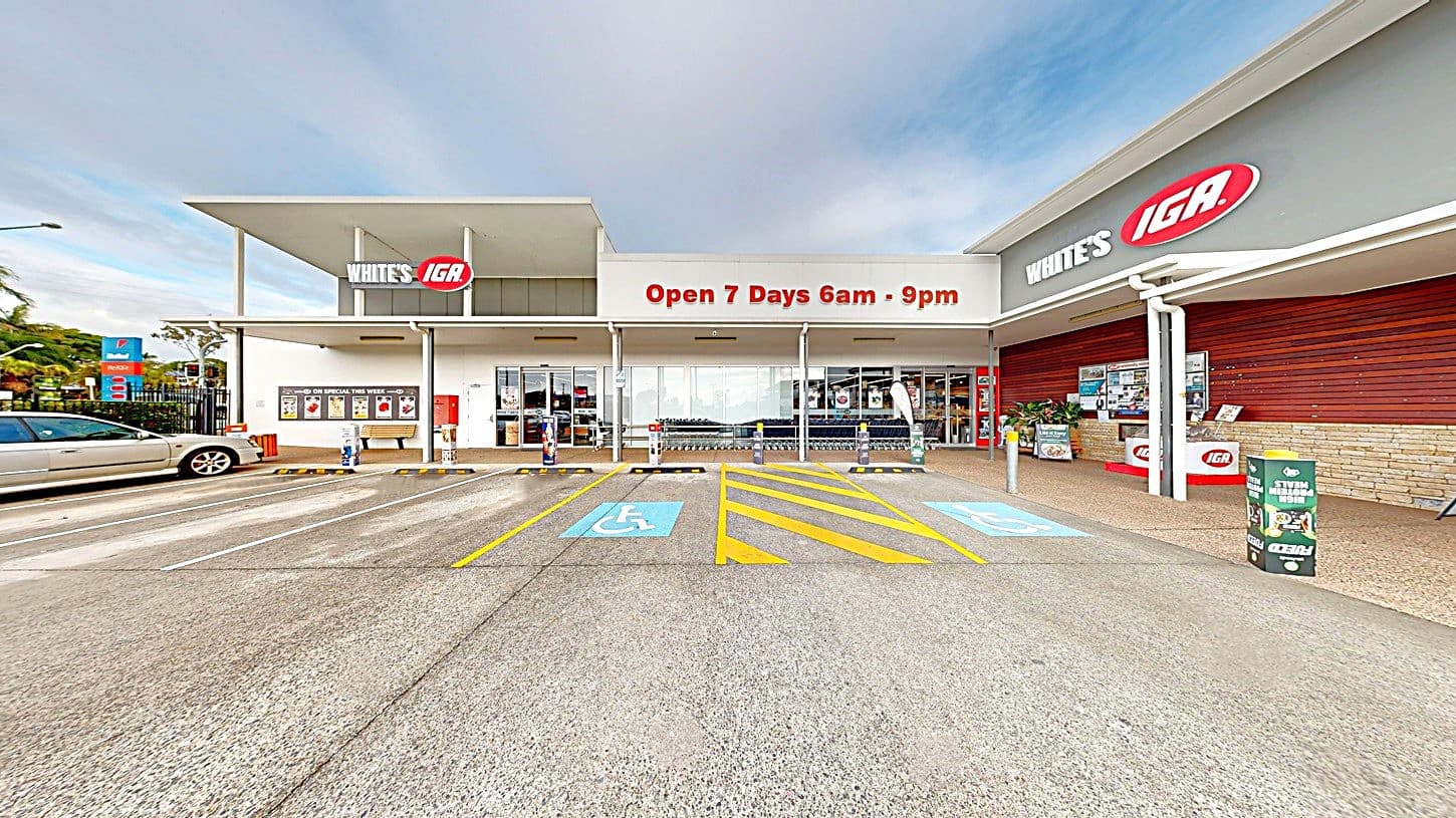 White’s IGA Bli Bli is a modern building with a distinct structural pattern painted in white, grey, and red, similar to its brand colors. “White’s IGA” brand name can be found on the upper walls of the venue, with their operating hours, Open 7 days, 6 am - 7 pm.