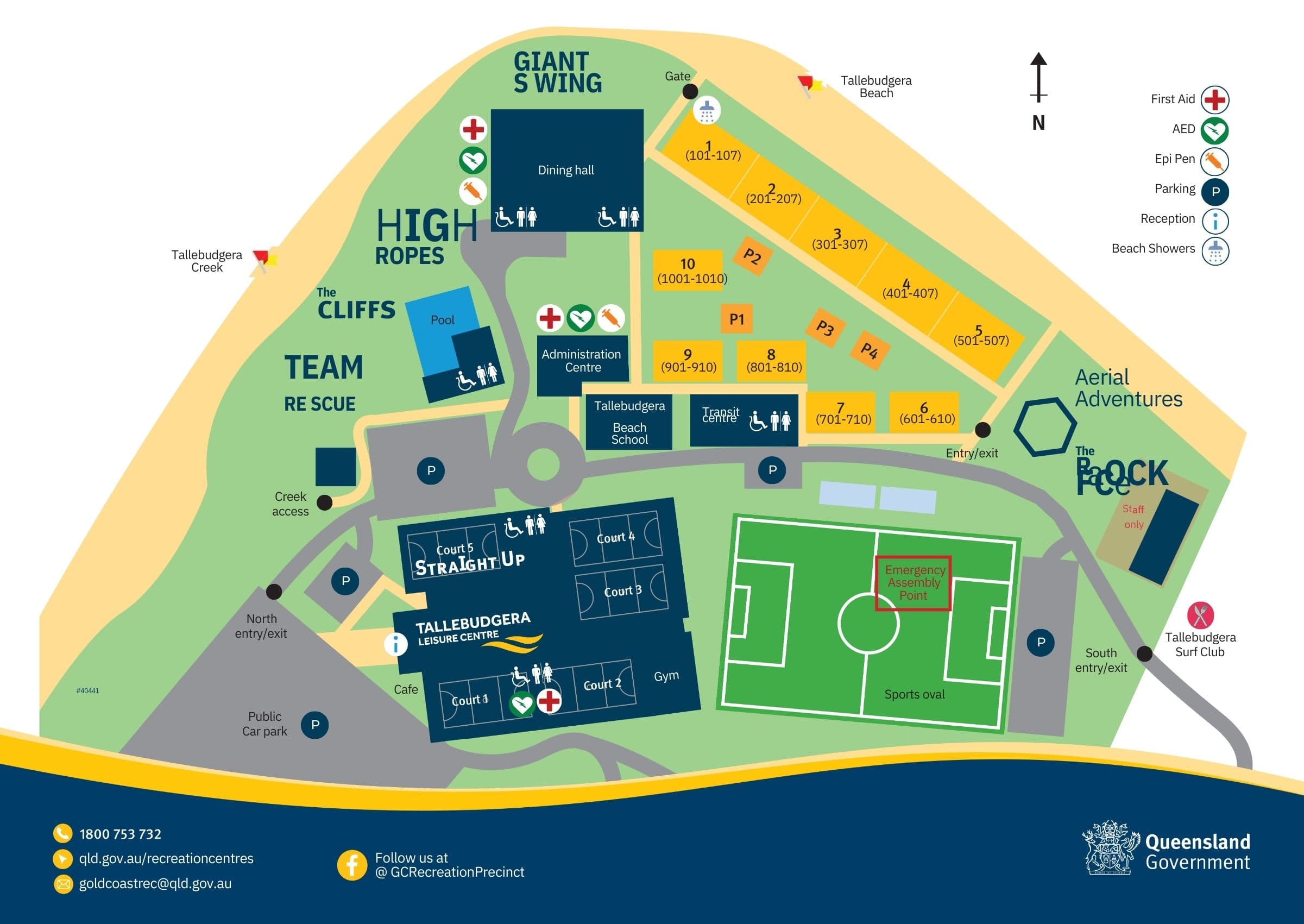 On the left, Tallebudgera Creek is highlighted near the cliffs, with a pool and parking areas nearby. In the centre, the Tallebudgera Leisure Centre includes several courts, a gym, and a café, adjacent to a large sports oval marked with an emergency assembly point. On the right, orange accommodation blocks are arranged around parking areas, with the dining hall and administrative centre nearby. The background features labelled areas such as Giant Swing and Aerial Adventures.
