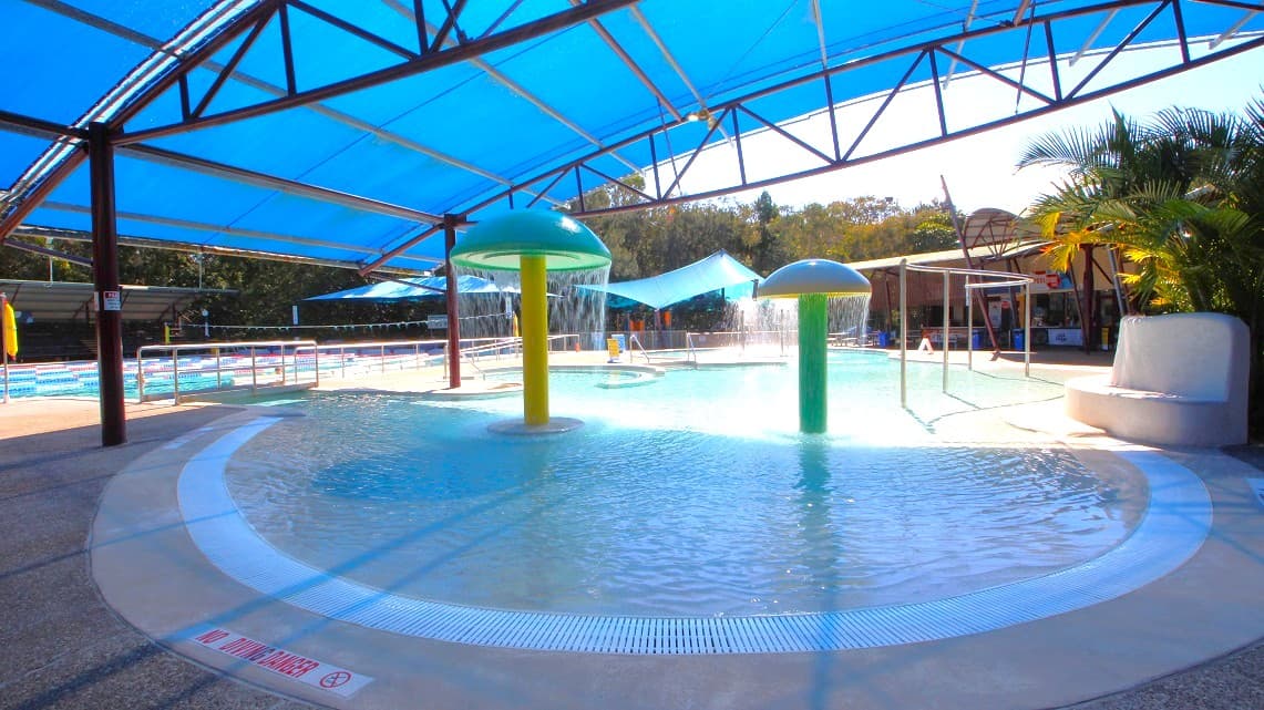 Open-air 25-meter pool with eight lanes featuring ramp access for convenience. Additionally, there's a kids' leisure pool with fun water fountains, perfect for little ones to enjoy. Among the bushland, there's also a relaxing whirlpool. Inside the pool area, you'll notice mushroom-like statues in the water for children to play under.