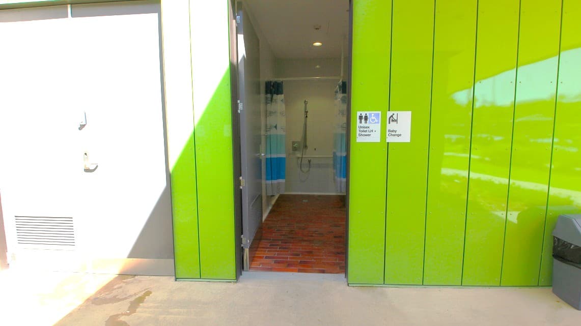 Another view of the bathroom's entrance. The marble tiled floors of the bathroom aisle complements the PVC door frame and aesthetic.