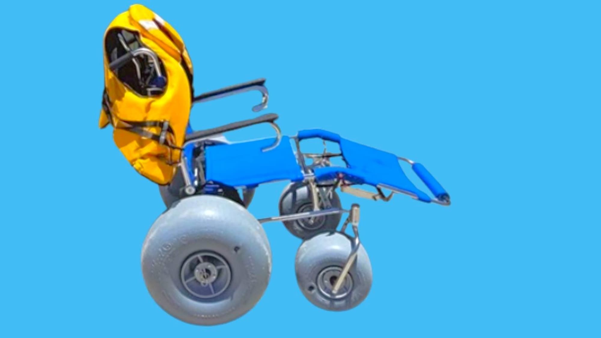 A yellow life vest is attached to the left side of a compact wheelchair frame. On the right, blue seats and backrest with metal support, and small wheels underneath. In the foreground, a large grey wheel on the left and a smaller wheel near the center-right sit on a flat blue background. The background is a solid blue.