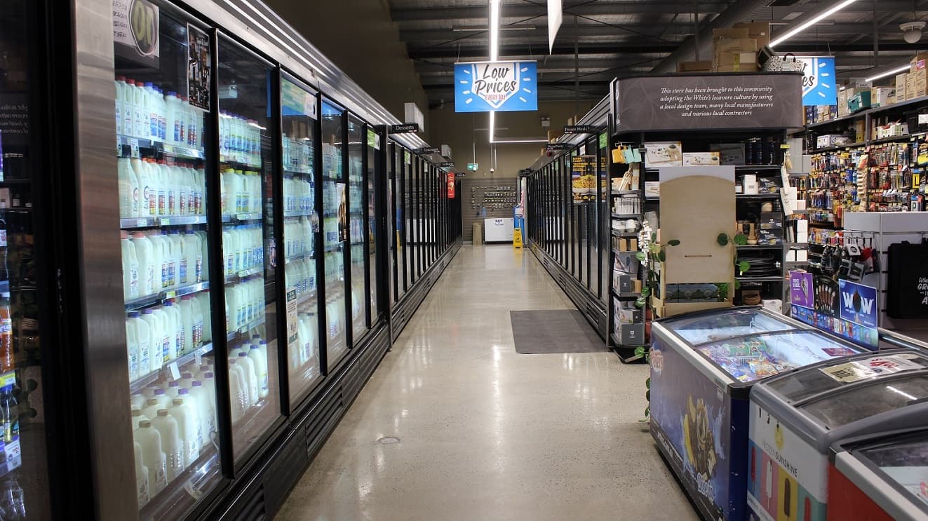 Several litres of milk are well refrigerated to keep its best quality on the continuous lineup of refrigerators and freezers. Directly opposite the milk fridge is the ice cream freezer with a double sliding door. Next to it are the shelves for different kitchen supplies and tools.