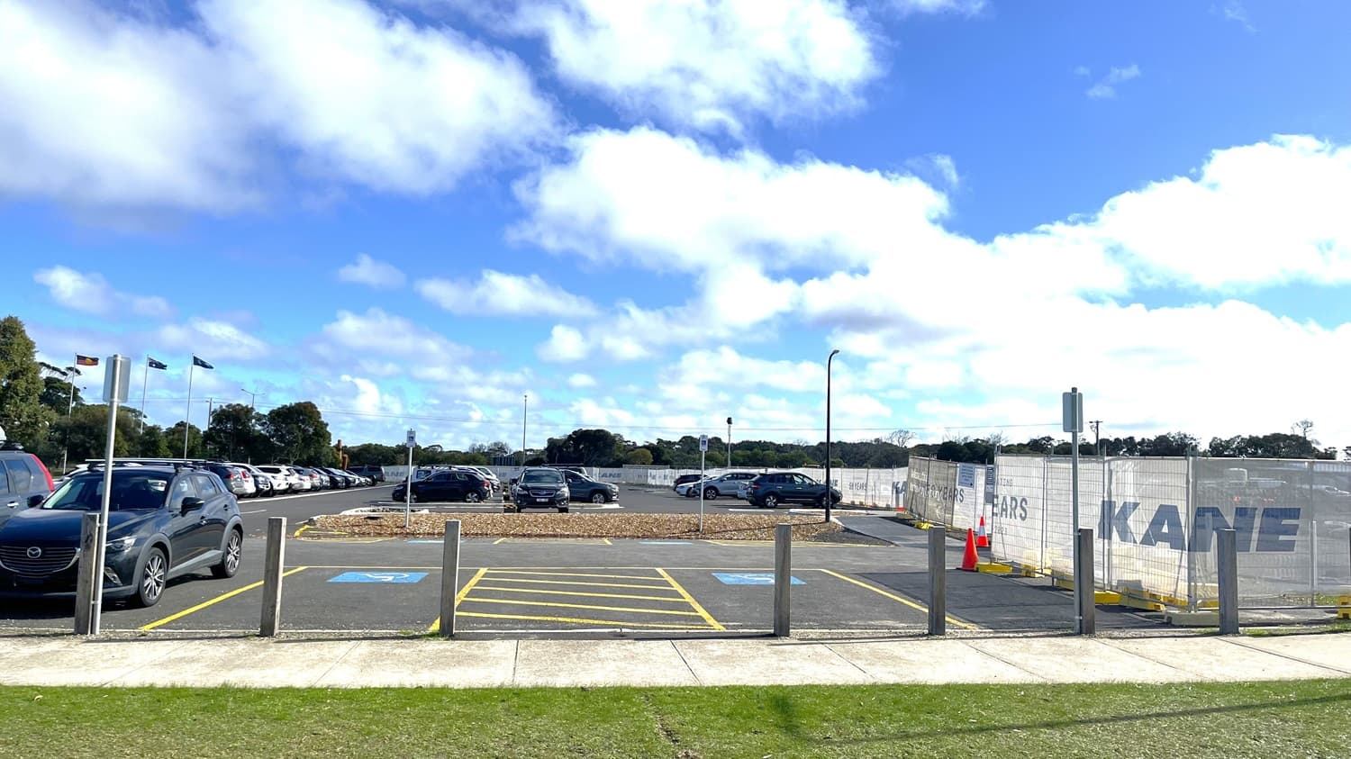 The available disabled parking in the carpark from Merrijig drive. Council offices to the left, construction to the right. Carparks look towards the oval and path to access Wurdi Baierr stadium