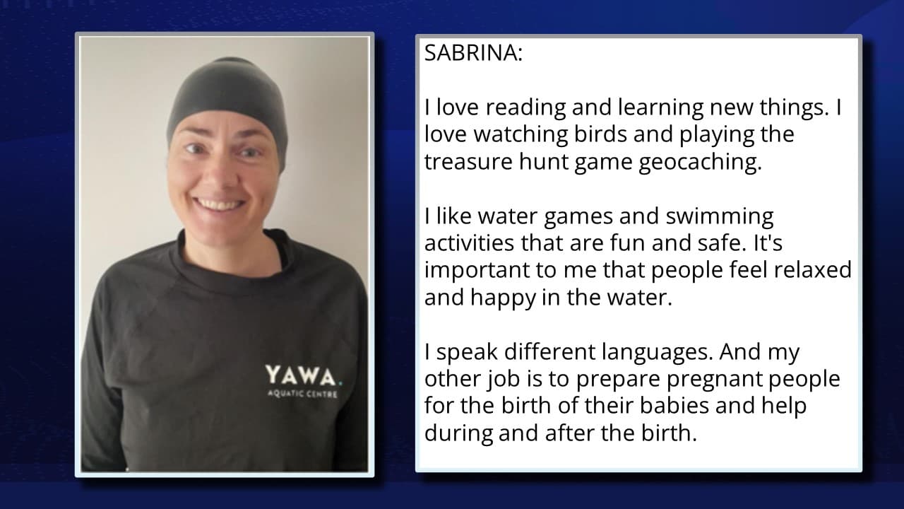 In the image, a woman named Sabrina smiles, wearing a black T-shirt with the "YAWA AQUA CENTRE" logo against a plain white background. A text box to the right displays her name and description. Sabrina enjoys birdwatching and geocaching, and she values safe swimming activities, aiming for people's relaxation in water. Fluent in multiple languages, her other role involves assisting expectant parents through childbirth and beyond, reflecting her enthusiasm for outdoor pursuits and aiding others.