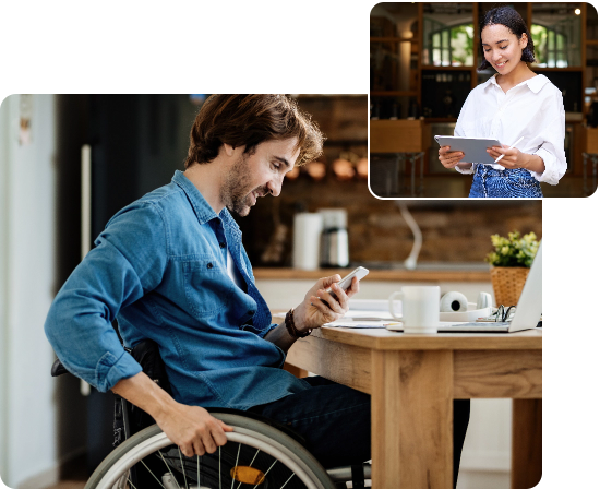 A young lady with short dark hair, white blouse and blue jeans holding a digital tablet at the entrance to a café, and A young man with brown hair, beard and fair skin wearing a blue long sleeve shirt and sitting in a wheelchair whilst holding a mobile phone.